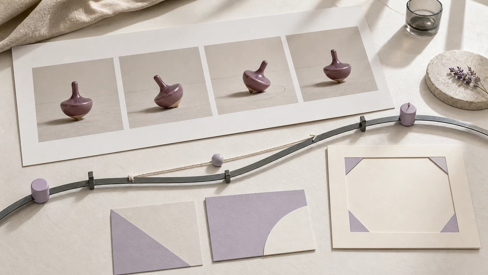 Physical reference-video planning board with four spinning-top source frames, a camera path, motion constraints, and a blank output-plan card